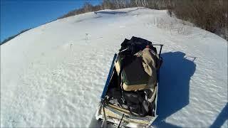 Мотобуксировщик штурмует снежные горы