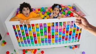 plastic balls in an amira crib