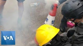 Hong Kong Protesters Put Out Tear Gas Grenades Using Traffic Cones