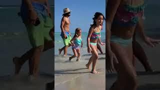 Kids are playing on the beach with sand and having fun. Miami Beach. White soft sand. Sun & Fun.