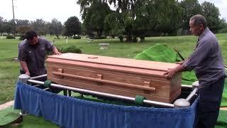 Casket Lowering in a Conventional Cemetery Burial