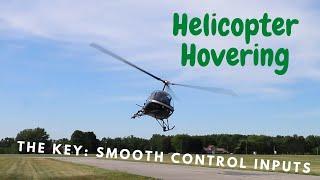 The Key To Helicopter Hovering: Smooth Control Inputs