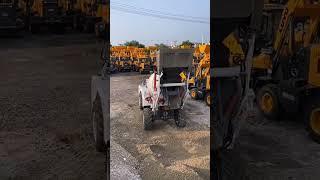 Self-loading concrete mixer