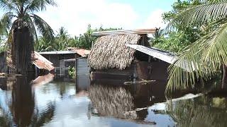 Residents of Douglas Village forced to cope with flooded homes and streets