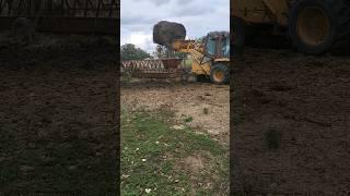 round bale CASE 580 backhoe