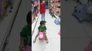 baby rides on pink cow toy #shorts