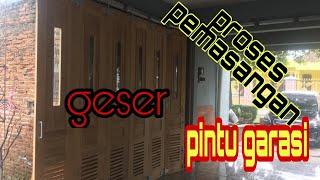 proses pemasangan pintu garasi rel geser loncer