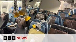 Singapore Airlines flight: Passengers tell of horror flight in which British man dies | BBC News