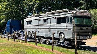 Transporting a bus the best way.  Unloading RGN removable gooseneck trailer ultra low height trailer