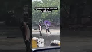 Man catches fish in the road,chennai michaung