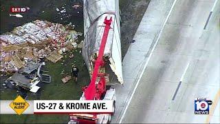 Overturned tractor-trailer causes rush hour delays in northwest Miami-Dade