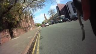 car turns right across cyclist path and gives him a brake test