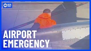 Man Arrested After Forcing Open Plane’s Emergency Exit Door | 10 News First