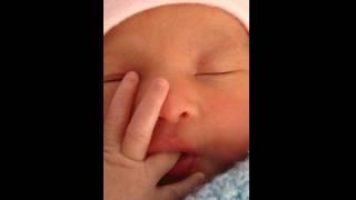 baby born sucking her own thumb