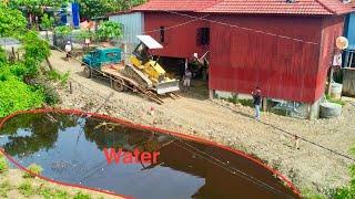 Landfill in Flooded Dozer D20A & Dump Truck 5T Pushing soil Into water​ To make a safe place.