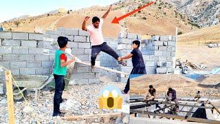 Roofing by a new master. Omid and his mother waiting for the house to be finished.