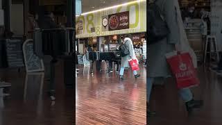 Stranger playing piano at Bergamo BGY airport - Milan, Italy