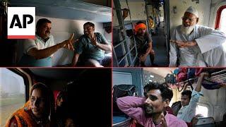 Indian voters talk to the AP about Modi's politics, elections on one of the longest train rides