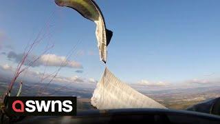 Paraglider nearly plunges 2,500 feet after the wing on his paramotor malfunctions mid-flight | SWNS