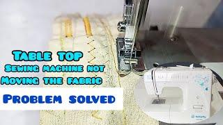 Tabletop top sewing machine not moving the fabric