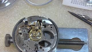 Installing mainspring in pocket watch, Girard Perregaux, Shell