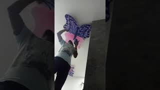 Painting butterfly on ceiling by faique ansari