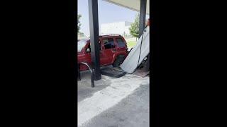 Vehicle backs into pump at west Lincoln gas station