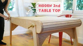 A mechanical table with a hidden puzzle surface