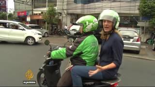 Motorbike app shakes up traditions in Indonesia