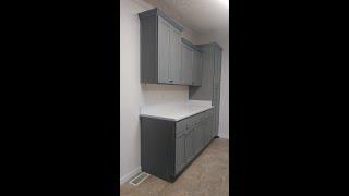 LG HiMacs Cloud Solid Surface with stainless steel undermount sink and gray cabinets