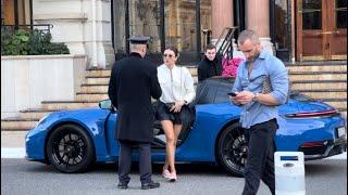 Rich Pretty Girl driving Porsche 911 targa GTS at Hotel de Paris in Monte-Carlo