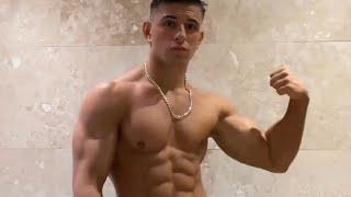 18 years old teen boy flexing muscle