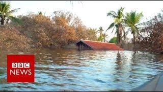 The flooded Cambodian villagers who refuse to move on - BBC News