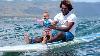 Father And Baby Daughter Go Tandem Surfing