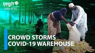 Crowd storms Covid-19 palliatives warehouse in Lagos | Legit TV