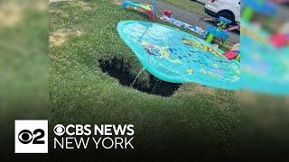 Toddler almost falls into sinkhole in New Jersey family's front yard