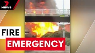 A suspicious scrub fire has quickly turned into a full-blown emergency in Port Melbourne | 7NEWS