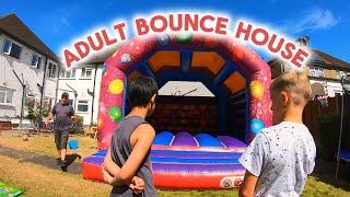 Setting Up An Adult Bounce House In A Communal Garden #bouncy #inflatable #adultbouncehouse