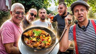 Goulash with wort in a cauldron under an open lid. Delicious lunch recipe