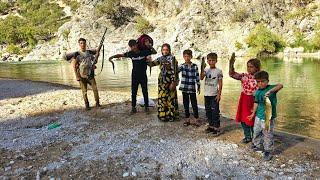 Fishing in the river by a nomadic family of 8