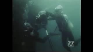 Vintage scuba girl trapped underwater out of air