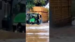 Tractor passing through 10 feet of water talent this driver