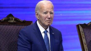 Joe Biden sits in trance at Philly church as pastor asks attendees to stand