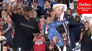 JUST IN: Trump Brings Artist 'Artlanta' On Stage To Sign Work Depicting 'Fight Fight Fight' Moment