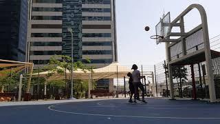 Mom and Khail playing basketball