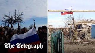 Russian troops raise flag in a village near Avdiivka