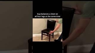 Guy Balances a Chair on all four legs at the same time