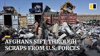 Afghans sift through US military junkyard for scraps to sell