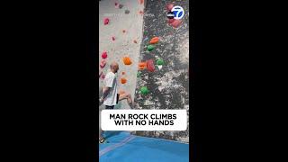 Climber scales wall in impressive 'no-hands' challenge