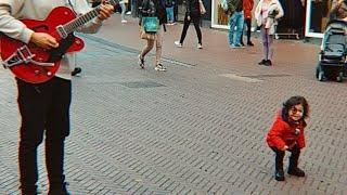 Cute Little Girl dancing with Street Performer